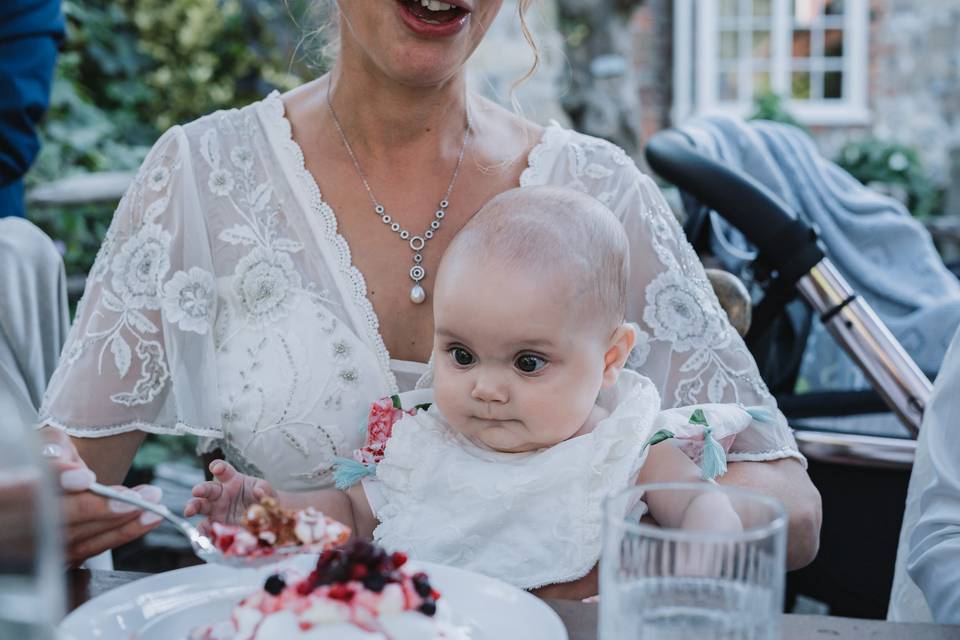 Baby with dessert at wedding