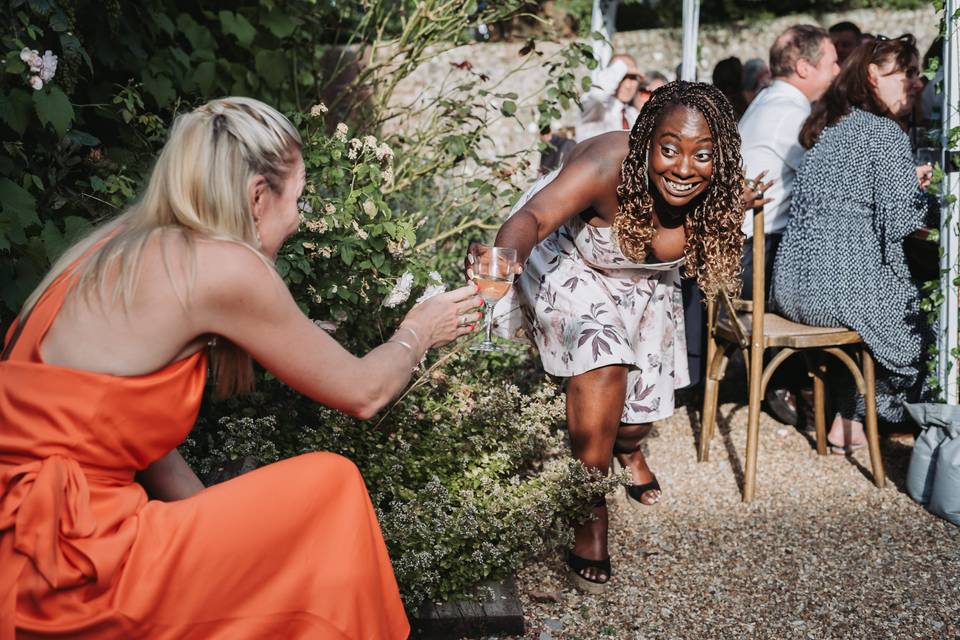 Guests laughing garden wedding