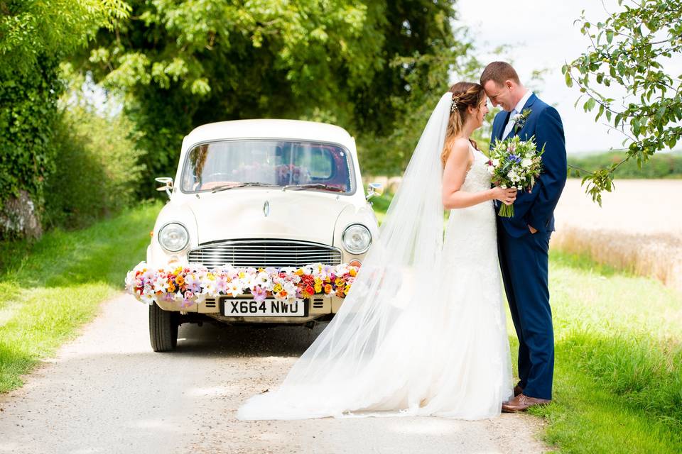 Couple in front of a classic car - Geoff Kirby Photography