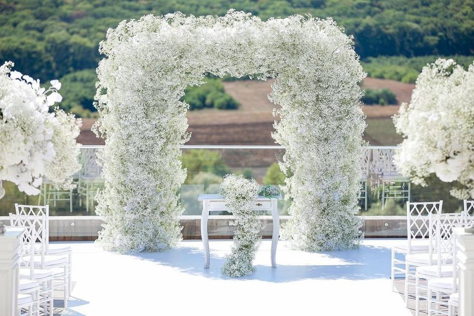 White floral arches