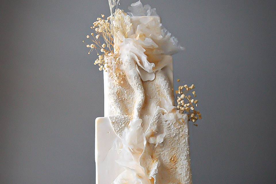 Cream and gold textured cake