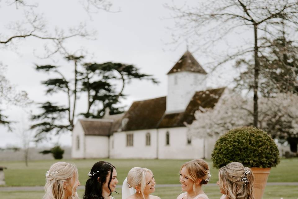 Bridesmaids by the church