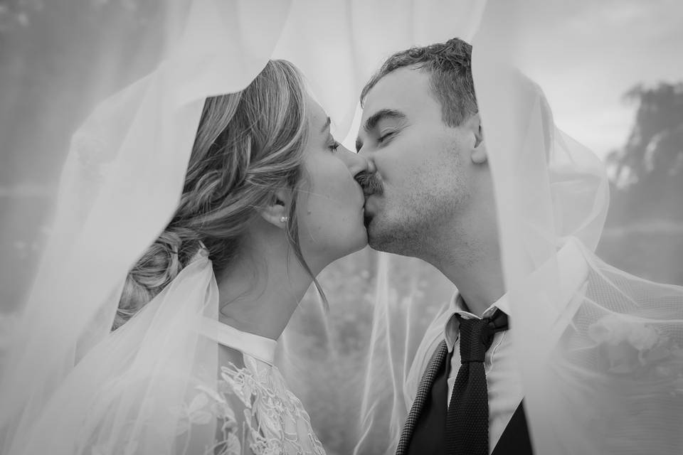 Bride and groom kiss