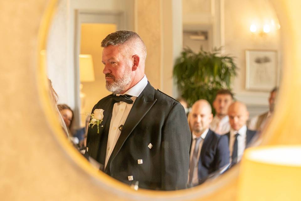 Mirror photo of groom