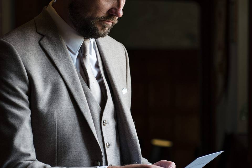 Groom reading card