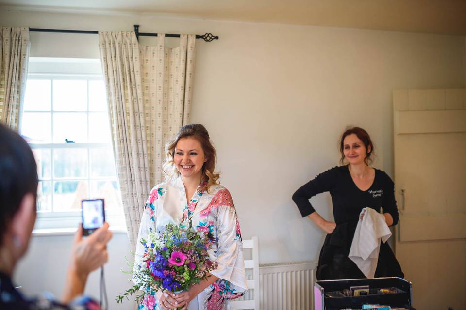 Bride receiving her bouquet