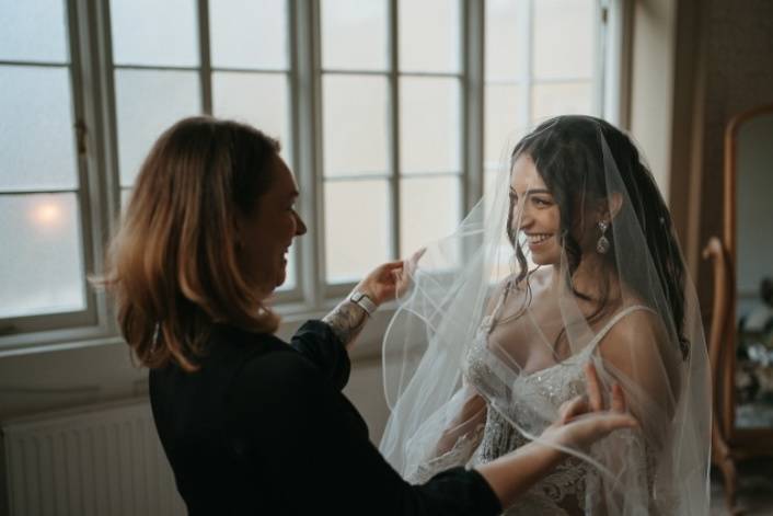 Smiling at her bride