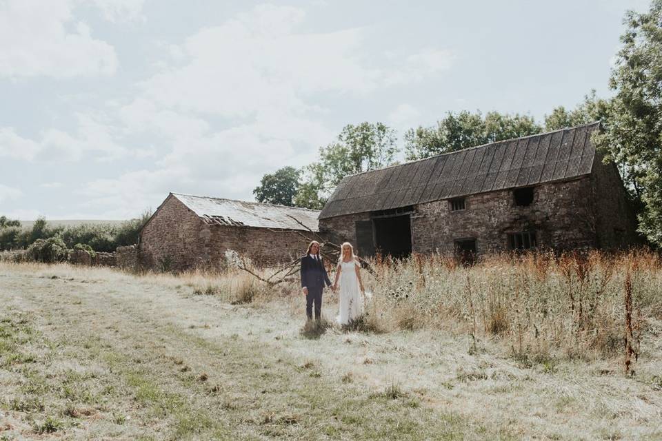 Standing in front of barn