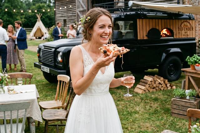 Bride Enjoying Pizza in Weddin