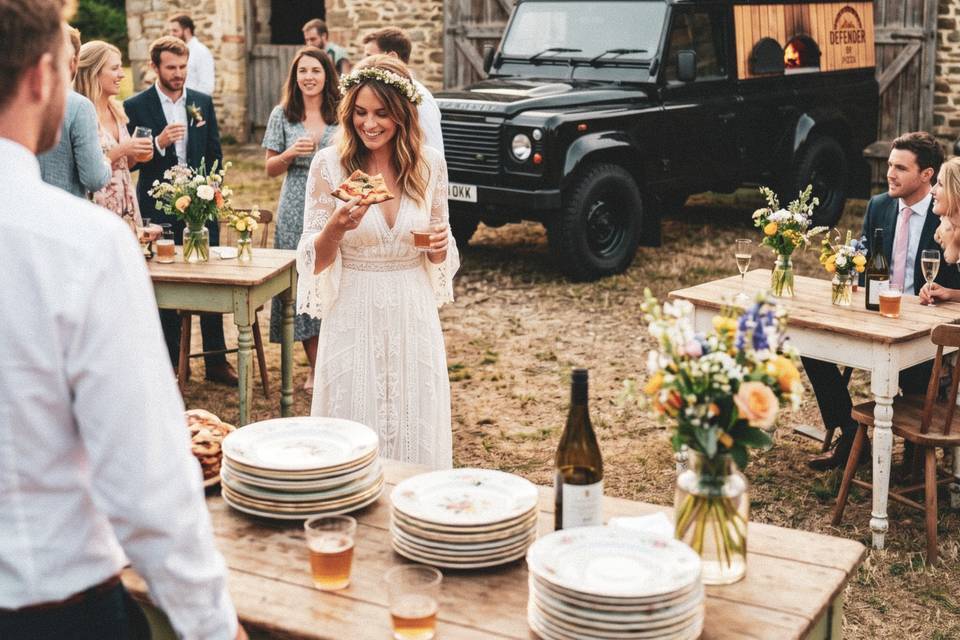 Bride with Pizza in Barn wed