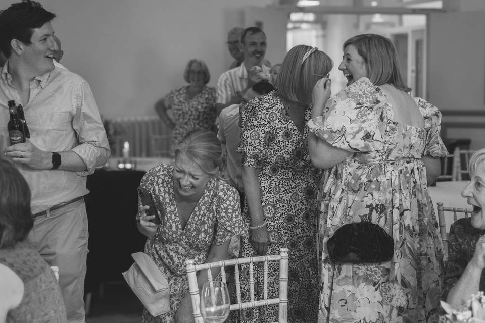 Guests laughing at speeches