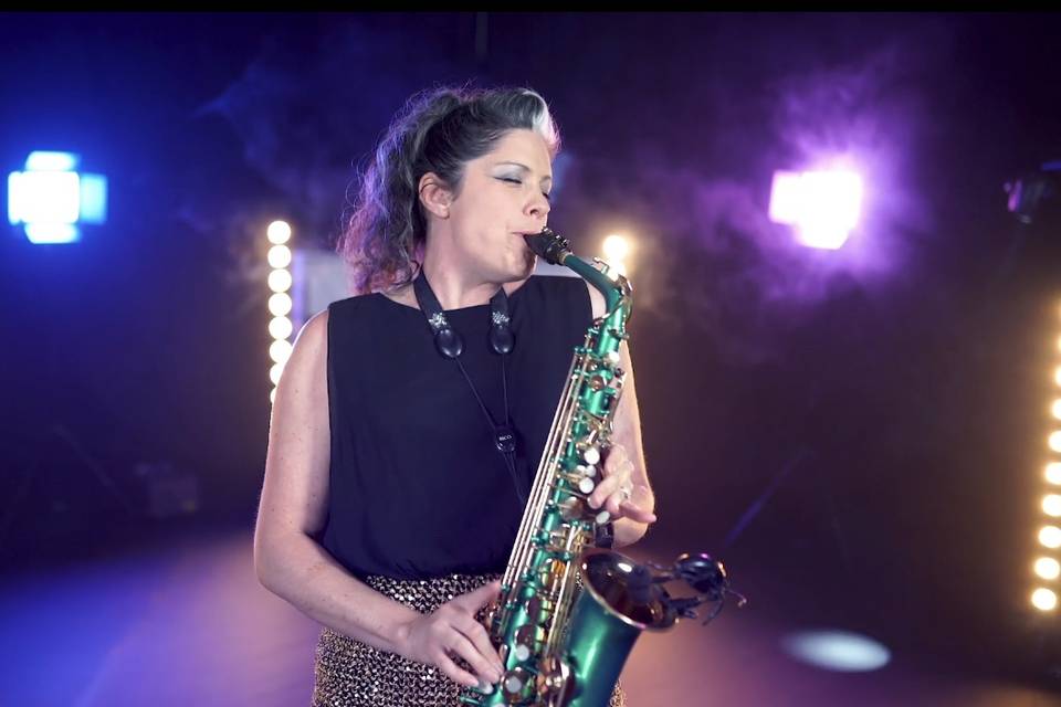 Lucy Harvey plays sax