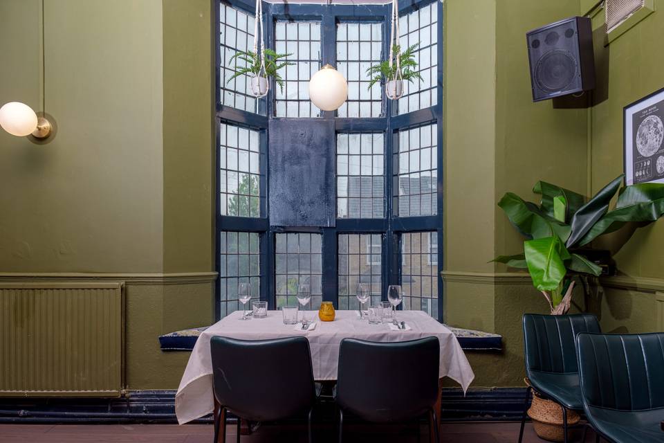 Large windows and green walls