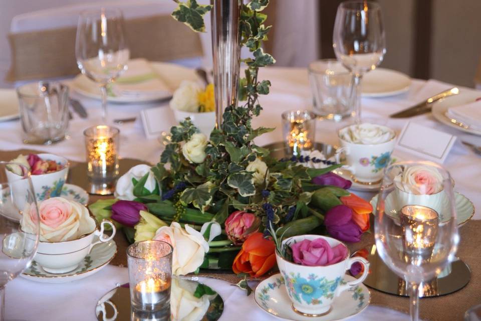 Teacups and saucers on candelabra