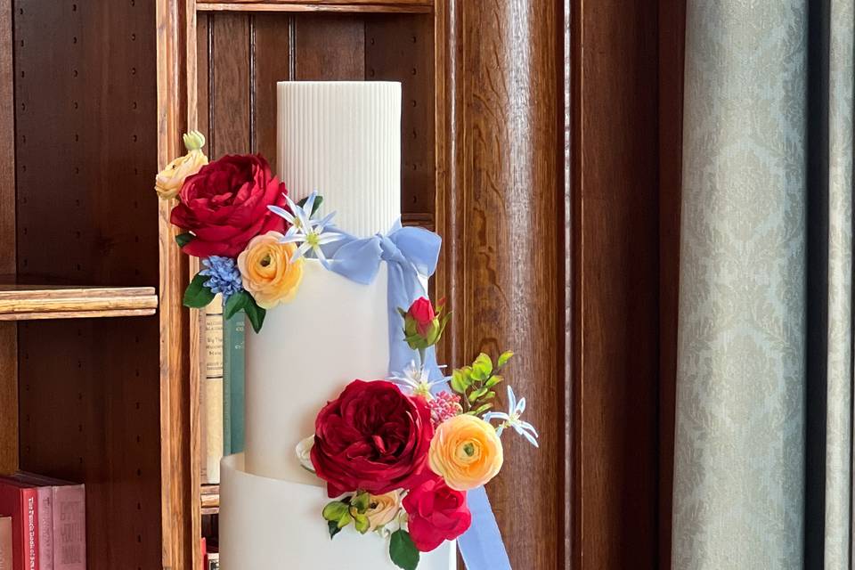 Floral cake with a ribbon