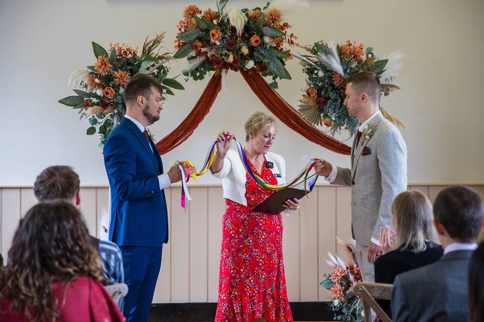 LGBTQ+ wedding with handtying