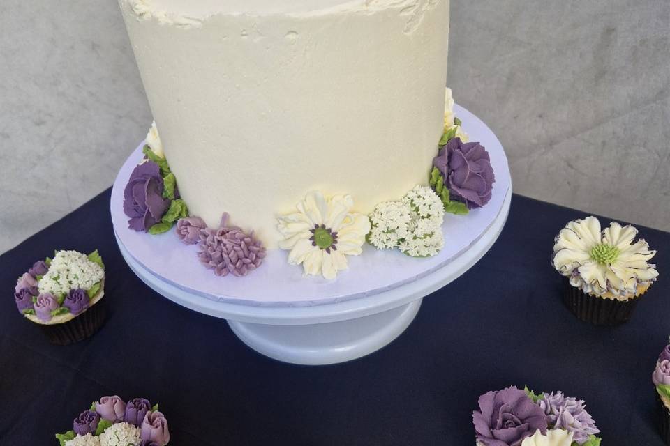 One tiered cake and cupcakes