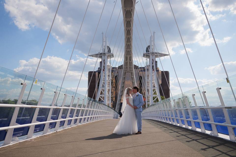 Bridge couple kissing