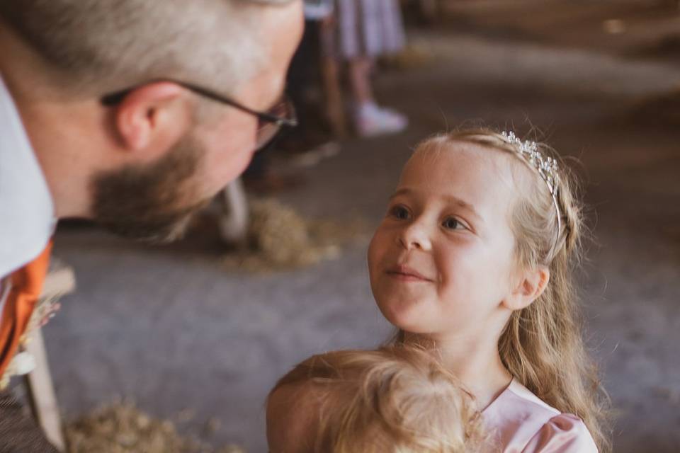 Flower Girl Greets Dad