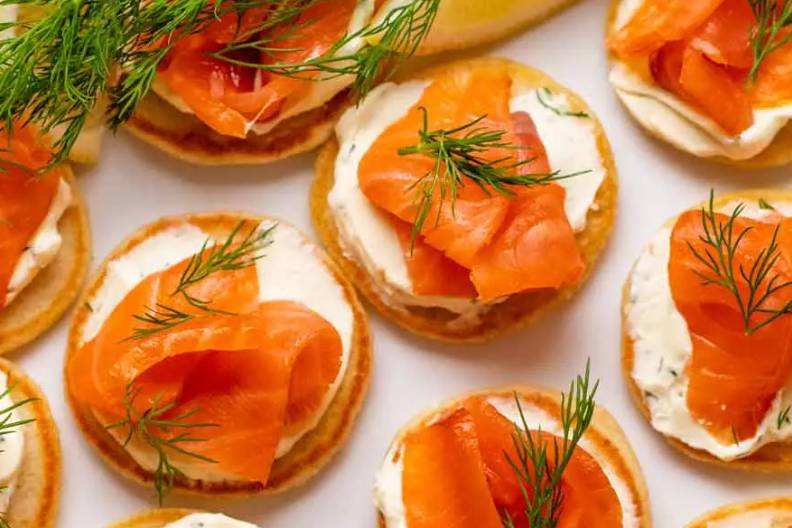 Salmon and tzatziki blinis