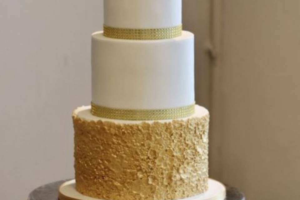 White and gold wedding cake