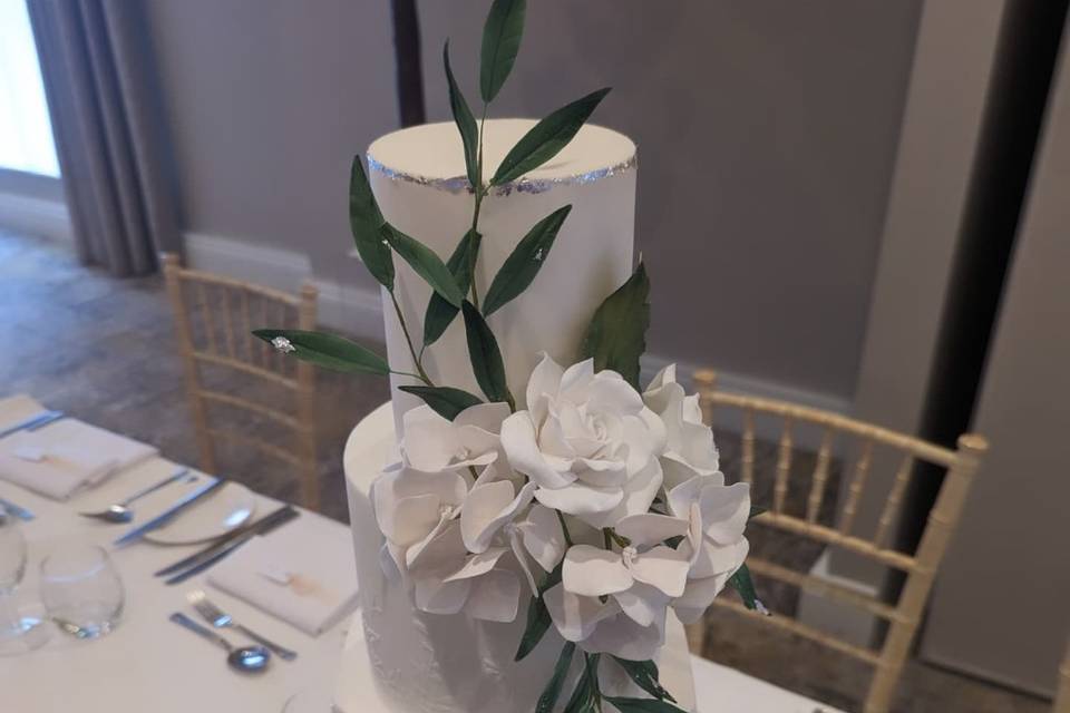 White cake with sugar flowers