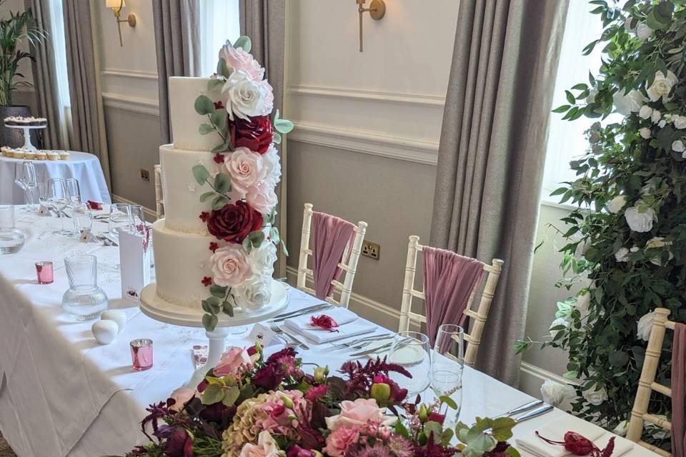 Lace and sugar flowers on cake