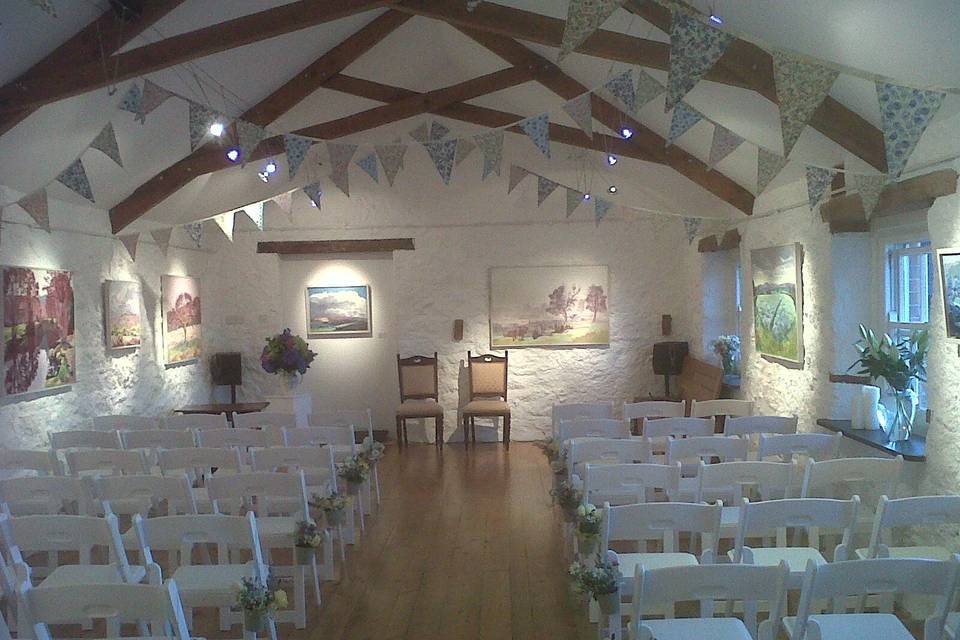 Gallery at Monks Withecombe with flowers and pretty bunting