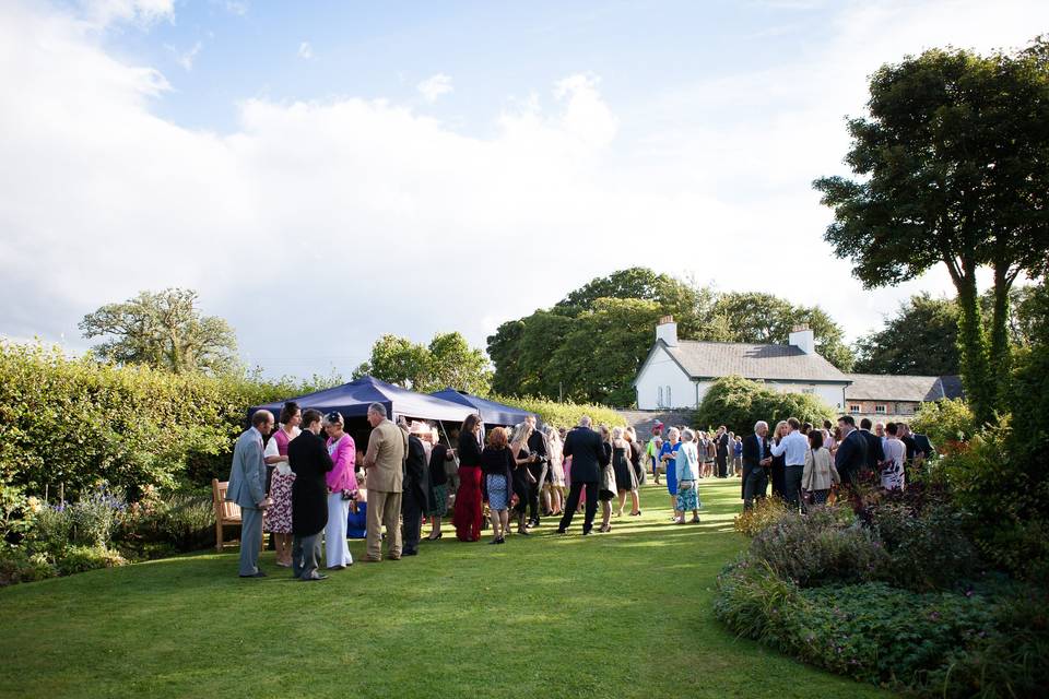 Wedding Guests in the Garden at Monks