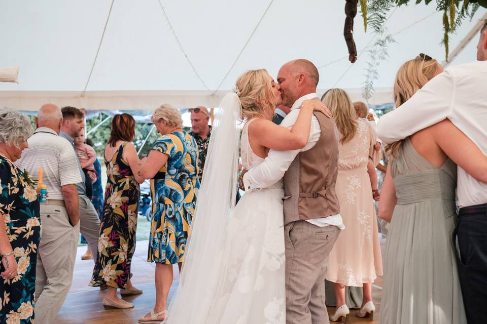 After first dance candid kiss.