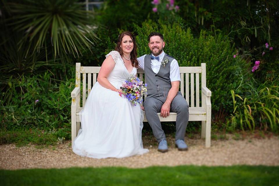 Bride and groom bench portrait