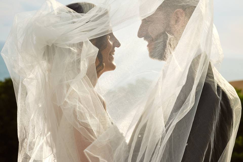 Bride, groom and veil