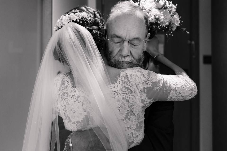 Father of groom hug