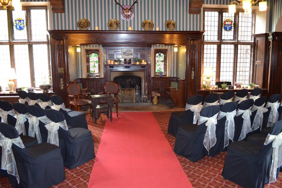 Ceremony set up in the oak panelled lounge in front of the fireplace