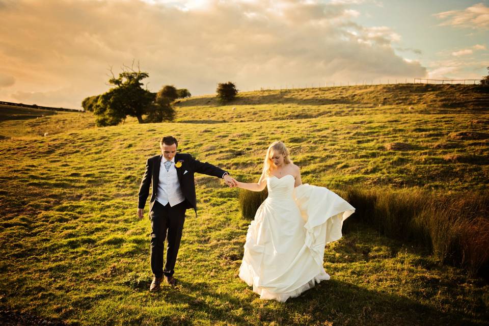 Bride and groom holding hands