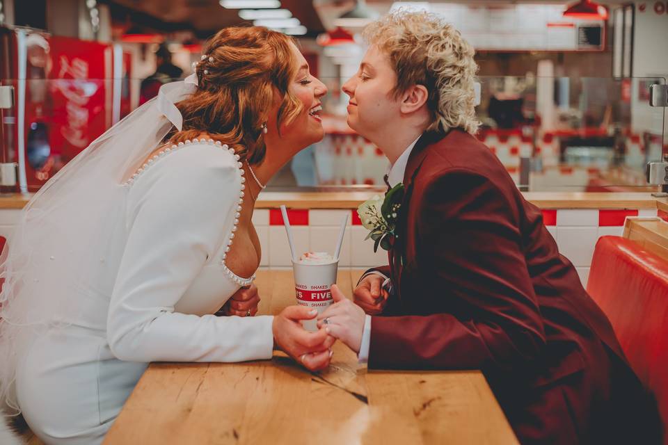 A kiss in Five Guys