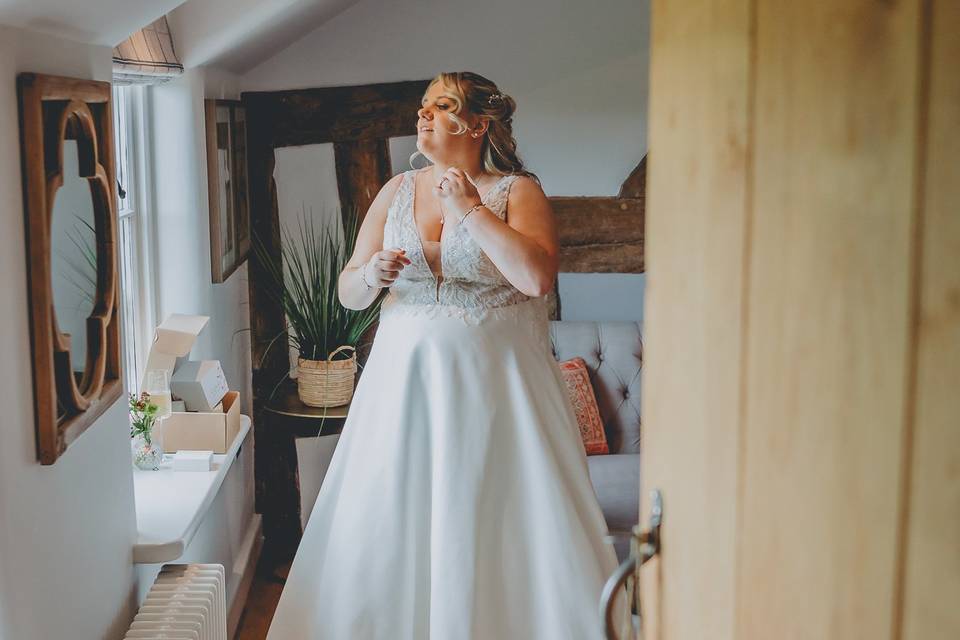 Bride spraying perfume