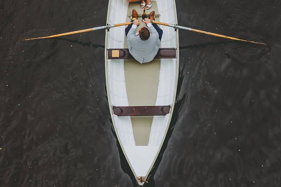 Bride and groom in rowing boat