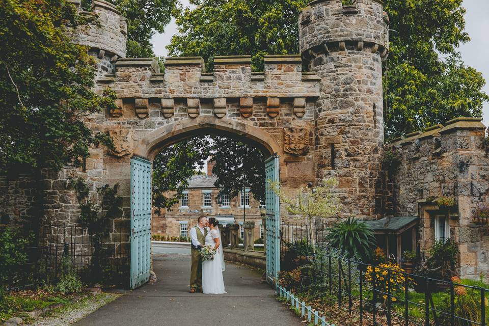 Bride and groom at castle gate