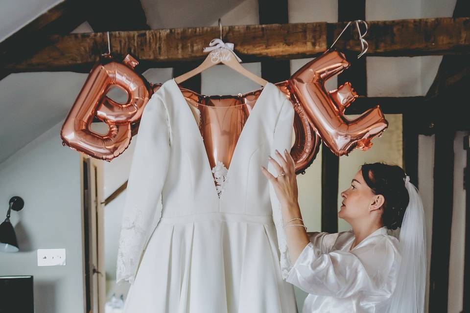 Bride admires dress