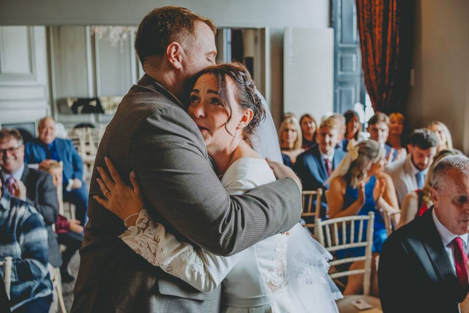 Bride and groom embrace