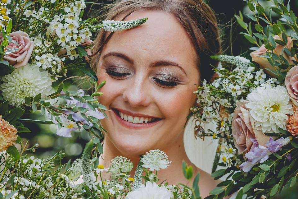 Bride surrounded by flowers