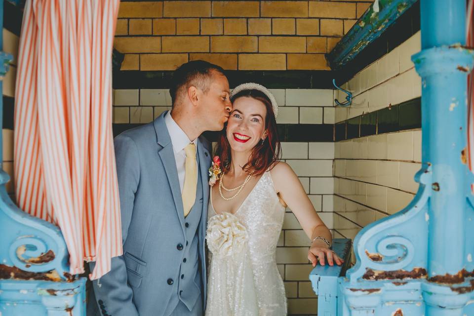Bride + groom in pool cubicle