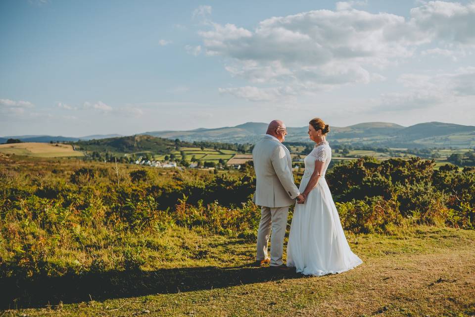 Bride + groom in Welsh hills