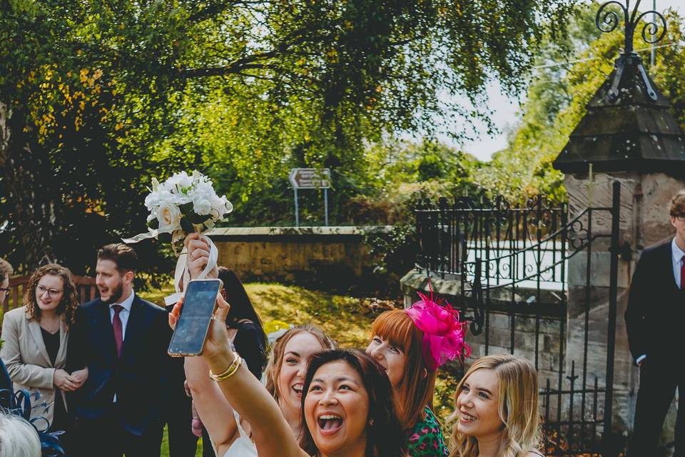 Group selfie with bride