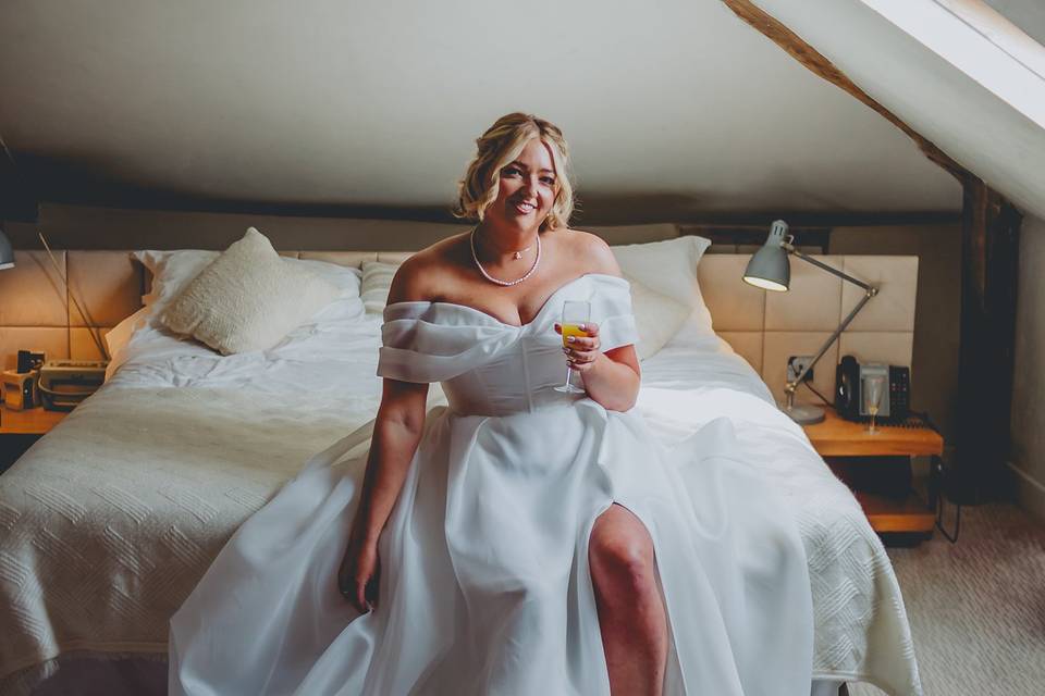 Bride sat on bed