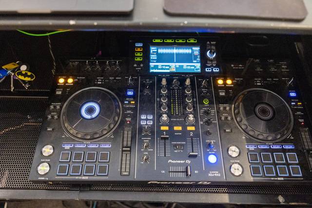 close up of dj controller deck with mixer knobs