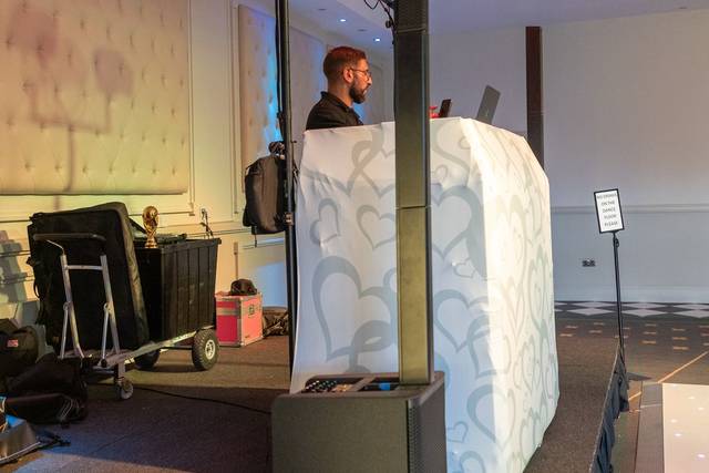 dj booth with high speaker towers in reception hall