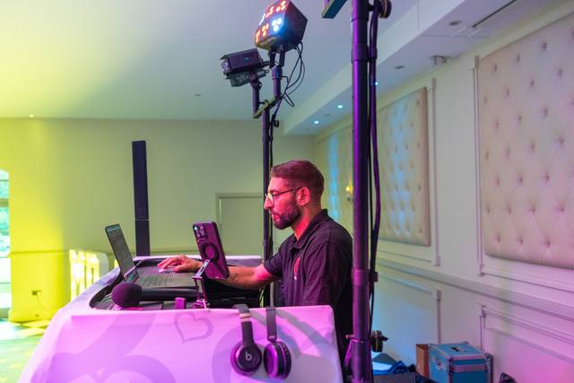 dj booth with spotlights and mixer closeup
