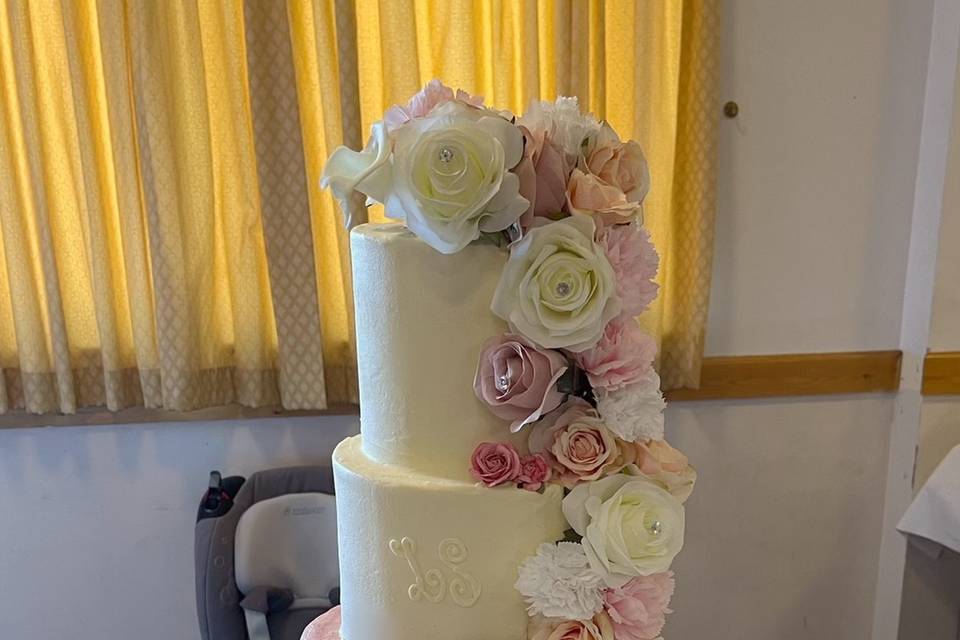 Three-tier floral buttercream cake